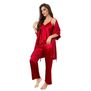 Three-piece red satin pajama set for women including camisole, pants, and long robe