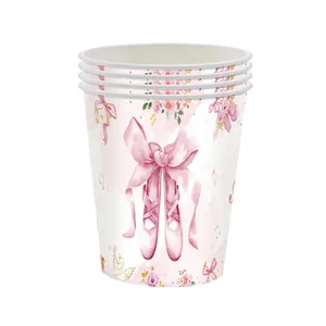 Close-up of disposable paper cups featuring pink ballet shoes and floral party patterns