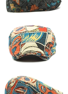 Detail of vintage ivy cap with butterfly embroidery and pop art prints and metal buckle