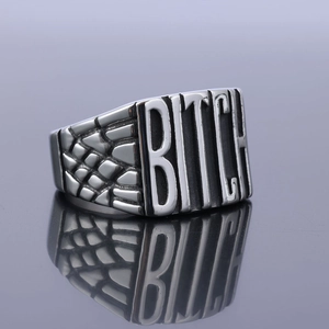 Punk style wide stainless steel ring with BITCH engraving and scale texture details