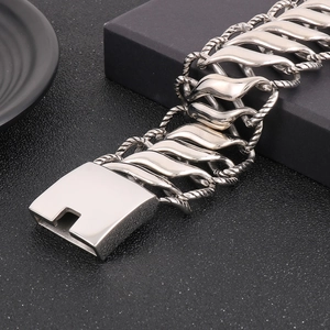 Macro shot of polished titanium steel bracelet with twist link and secure buckle