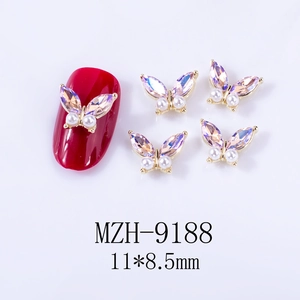 Macro view of butterfly nail charm with gold alloy and purple aurora rhinestones