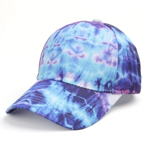 Close-up of tie-dye baseball cap featuring blue and purple fabric textures and stitching