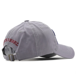 Detail view of grey cotton baseball cap with red BLACKREBEL embroidery and metal buckle