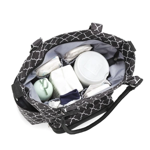Top view of spacious interior layers and compartments of the black geometric diaper bag