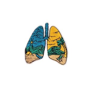 Lungs shaped embroidered iron-on patch featuring colorful mountain and beach landscape