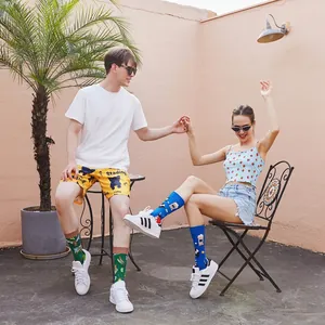 Fashionable mid-calf socks with colorful popcorn and cartoon prints on outdoor models