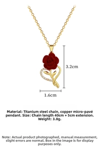 Macro view of a 1.6x3.2cm red rose heart pendant with sparkling crystals on titanium chain