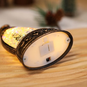 Detail of Christmas lantern base with battery compartment and manual toggle power switch