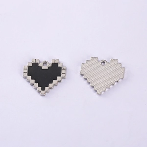 Front and back view of pixelated heart pendants in black and silver zinc alloy