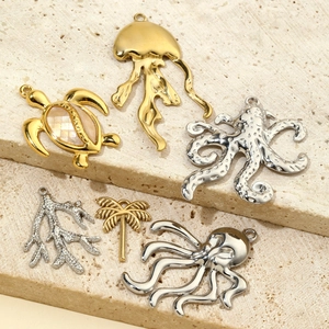 Collection of gold and silver tropical ocean charms featuring turtles and palm trees