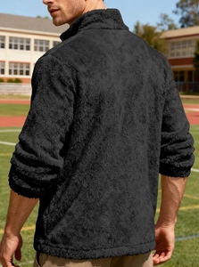Detail view showing the plush black fleece texture and zipper on the back of the jacket
