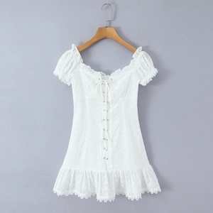 Chic white off-shoulder mini dress with embroidery, puff sleeves and lace-up front