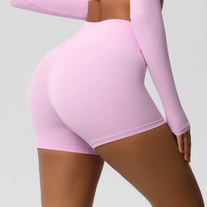 Detail showing high-waisted seamless design and peach lift cut on pink yoga shorts