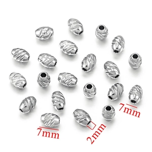 Macro detail of 7mm silver stainless steel spacer beads with 2mm hole for DIY jewelry