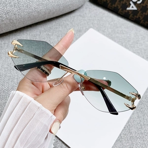 Chic rimless polygon sunglasses with green gradient lenses and golden metal claw accents