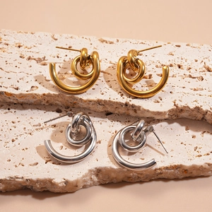 Twisted geometric knot stud earrings in 18k gold and silver stainless steel