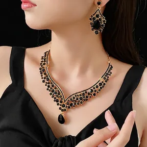 Vintage V-shaped necklace and drop earring set with black crystals and gold finish