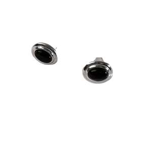 Minimalist 925 sterling silver stud earrings featuring black oval gemstones on white background