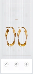 Detailed view of 18K gold plated stainless steel U-shape twisted ribbon hoop earrings