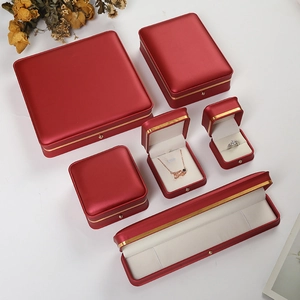 Premium red leather jewelry box set with gold trim for rings, necklaces and bracelets