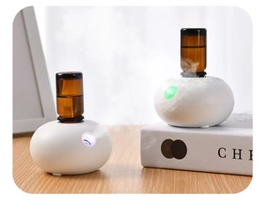 Waterless essential oil diffuser with pebble design and colorful LED atmosphere light