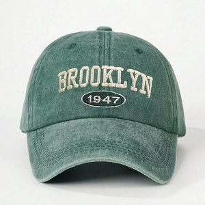 Vintage dark green washed cotton baseball cap with Brooklyn 1947 embroidery on white back