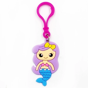 Cute cartoon mermaid keychain accessory with purple hair and blue scales on white background