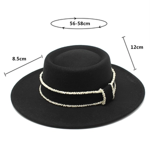 Detail of black wool felt boater hat showing dimensions 56-58cm with pearl trim