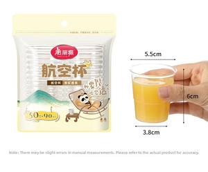 Detail showing hand holding a 90ml thick plastic tasting cup with size measurements