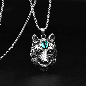 Pendentif tête de loup argenté style punk avec œil bleu sur chaîne box