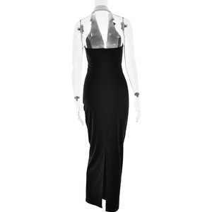 Detail view of the back showing halter neck style with a deep open back and a hem slit