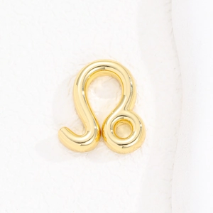 Macro detail of a 12 Zodiac Leo sign gold balloon pendant with mirror polish finish