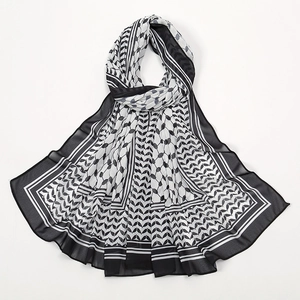 Detail showing checkered print and leaf pattern on thin breathable chiffon scarf