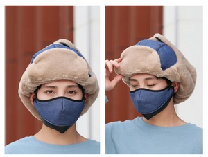 Detail of winter trapper hat with warm faux fur lining and matching face mask in navy blue