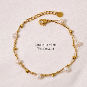 Detail of double-layer gold pearl bracelet showing lobster clasp and s.steel engraving