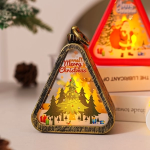Close-up of a vintage golden triangular Christmas lantern with warm LED light and decor