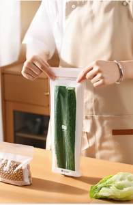 Extra long transparent food storage bag for storing fresh cucumbers in the kitchen