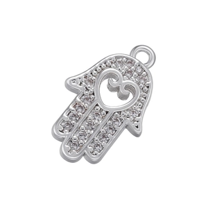 Detailed view of silver Hamsa Hand pendant with micro-pave stones and heart cutout
