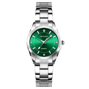 Women's quartz watch with green dial and silver stainless steel strap on white background