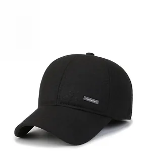 Close-up of black wool baseball cap with metallic Sports logo and twill texture fabric