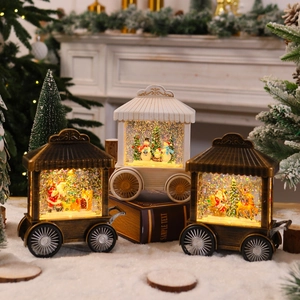 Detailed view of illuminated Christmas snow globe lanterns with Santa and reindeer scenes
