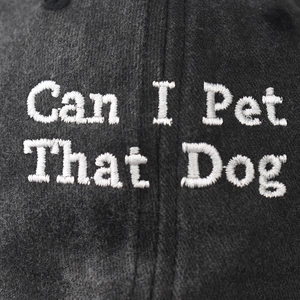 Washed dark grey baseball cap featuring white 'Can I Pet That Dog' embroidery detail