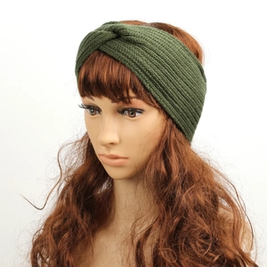 Detail of dark green chunky knit headband with twisted knot design on mannequin