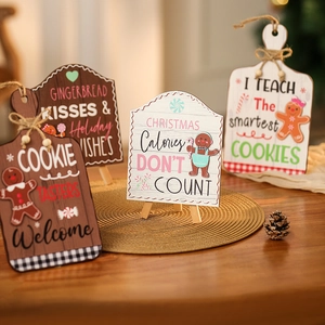Festive wooden gingerbread man welcome signs in brown and white for Christmas decor