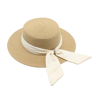 Elegant wide brim straw sun hat with cream ribbon and crystal buckle detail