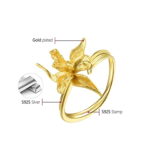 Detailed macro view of S925 silver iris flower ring with gold plated matte texture