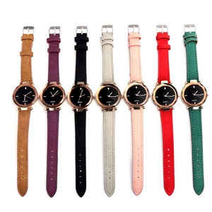 Detail showing various colors of quartz watches with leather straps and rose gold cases