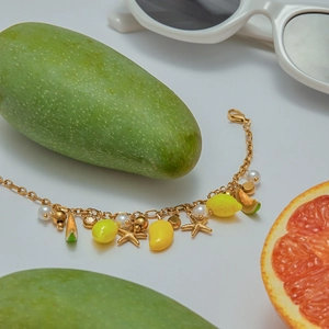 Tropical fruit charm bracelet with lemon and grapefruit slices on a summer beach theme