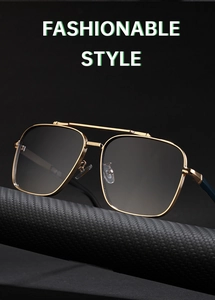 Detail view of double bridge square sunglasses with gold metal frame on carbon texture